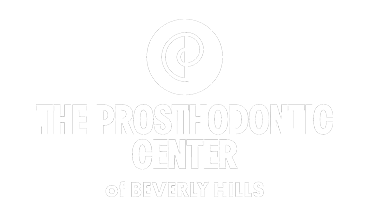 The image shows a logo for the Prosthodontic Center of Beverly Hills, which is part of the Prosthodontic Modesto Center.